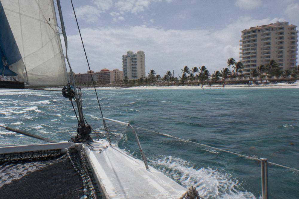 Catamaran sailing along the Palm Beach coastline past high-rise hotels